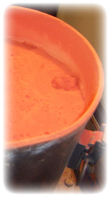 A picture of orange powder, photograph taken at Erie Powder Coating.